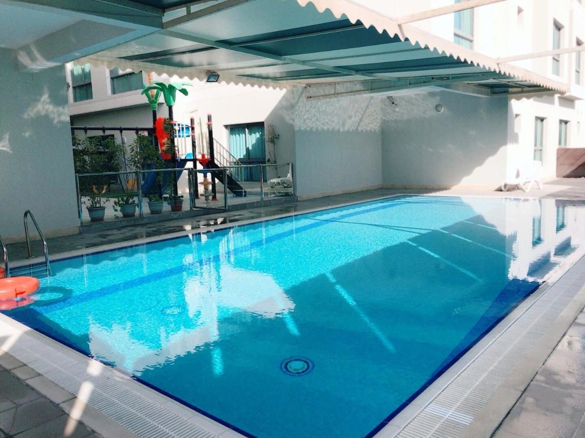 Stout Apartments Manama Zimmer foto